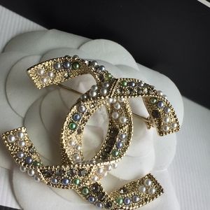 Chanel Authentic Gold Brooch with box and Pouch